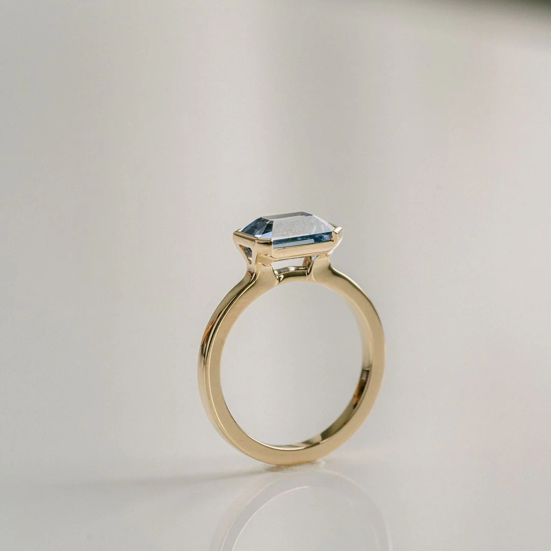 Emerald Cut Blue Sapphire East-West Half Bezel - Image 3