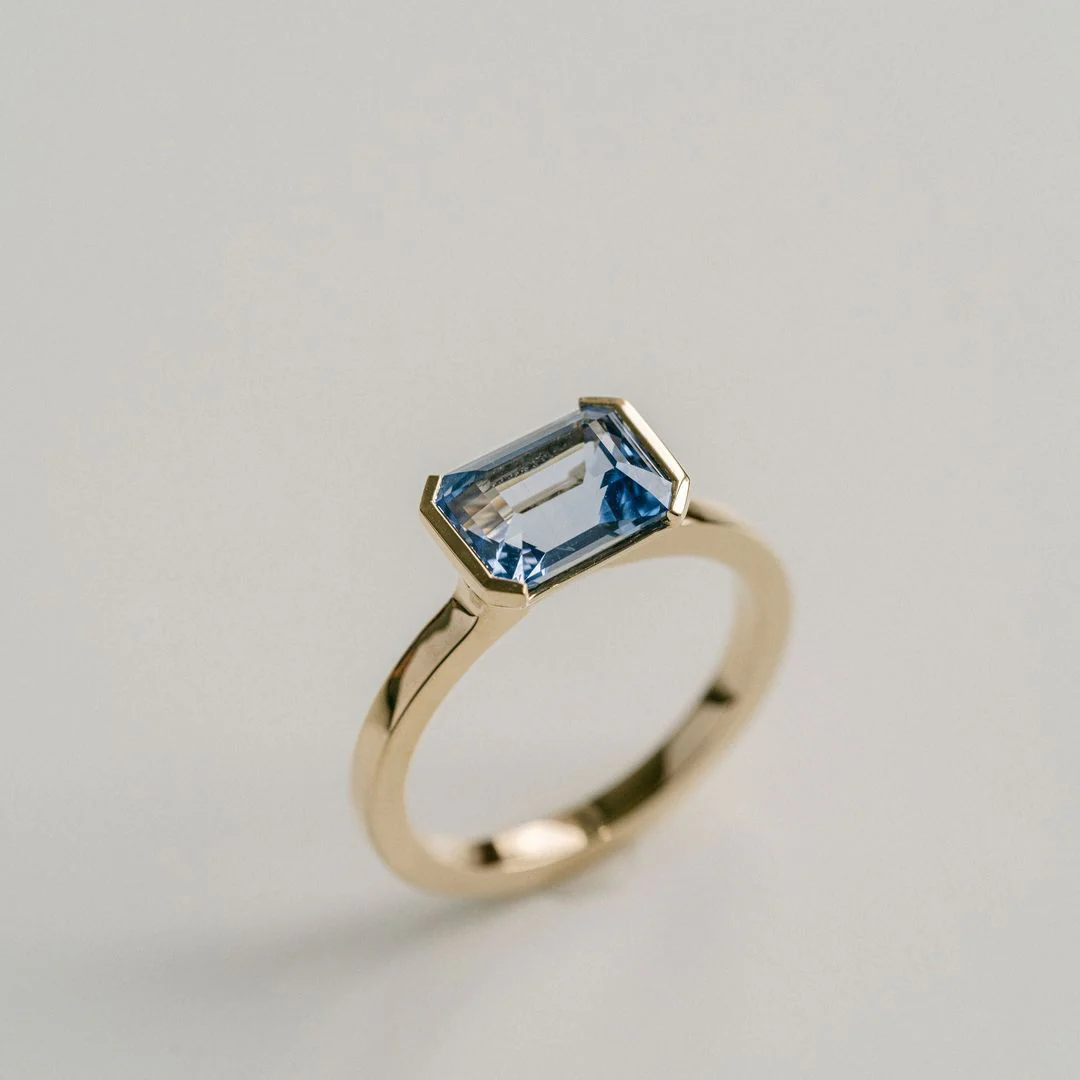 Emerald Cut Blue Sapphire East-West Half Bezel - Image 4
